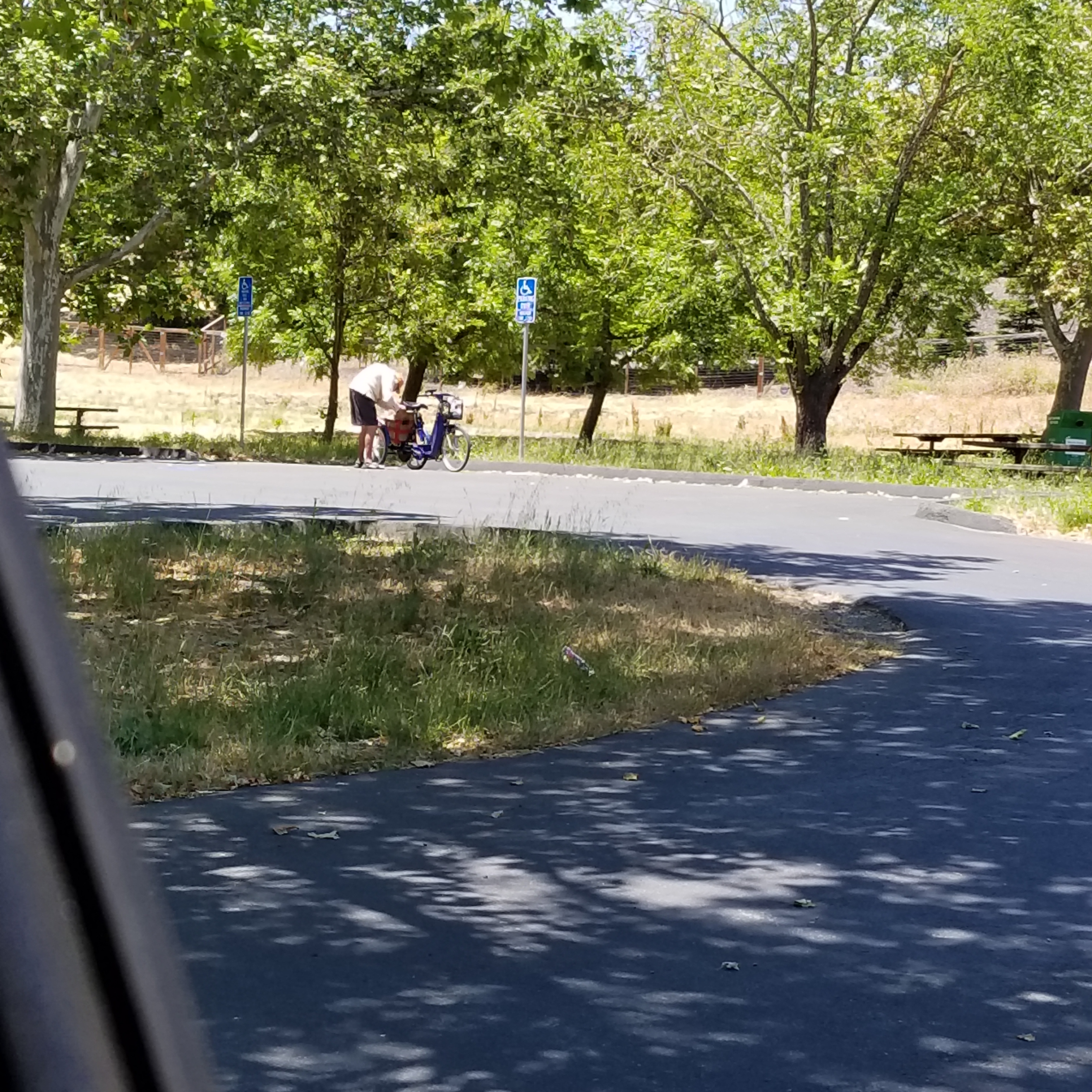 Older Gentleman adjusting his three wheel bike along Lafayette Moraga Trail